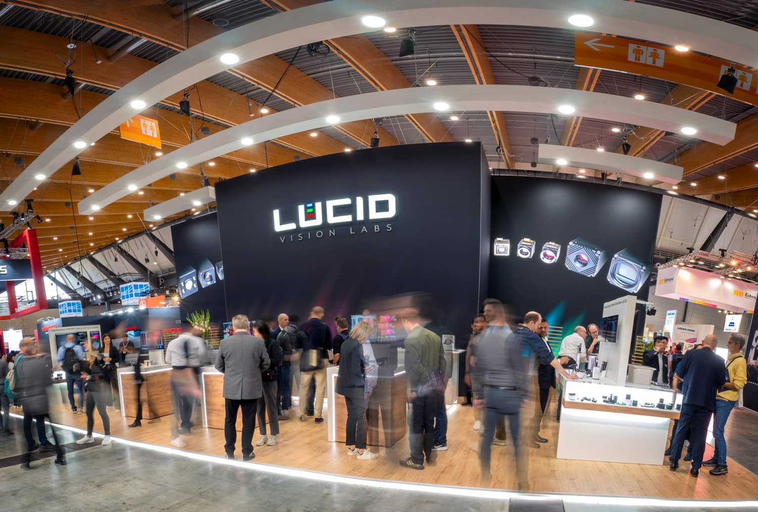 LUCID Vision booth 2024 with people